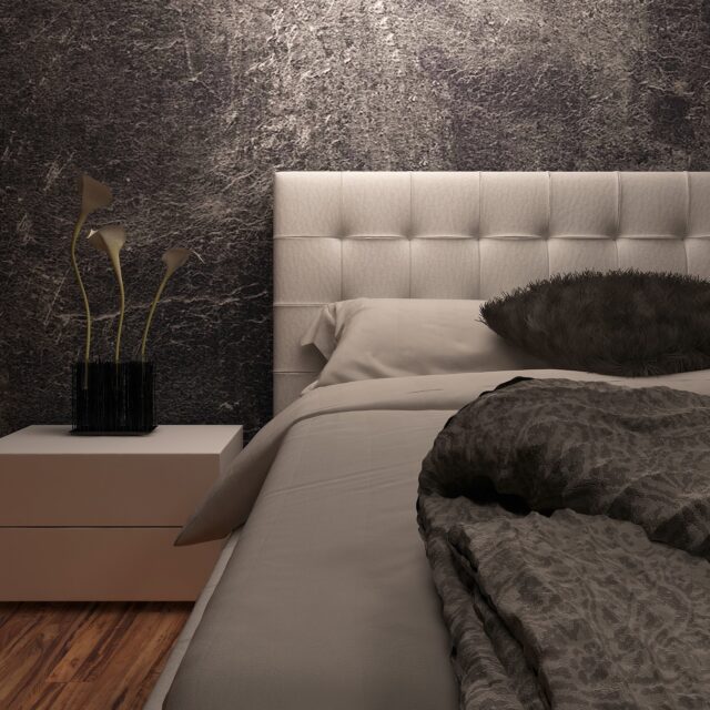 White huge bed standing against dark black wall
